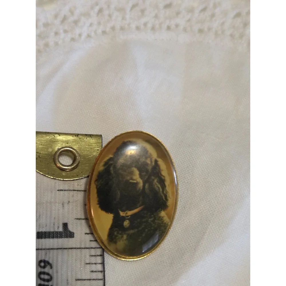 vintage Otter House lapel pin featuring a portrait of a black poodle